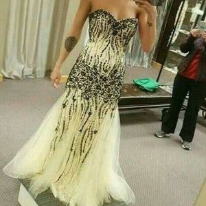 Cream and black beaded prom dress.